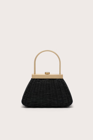 Black woven handbag with a gold handle on a light beige background