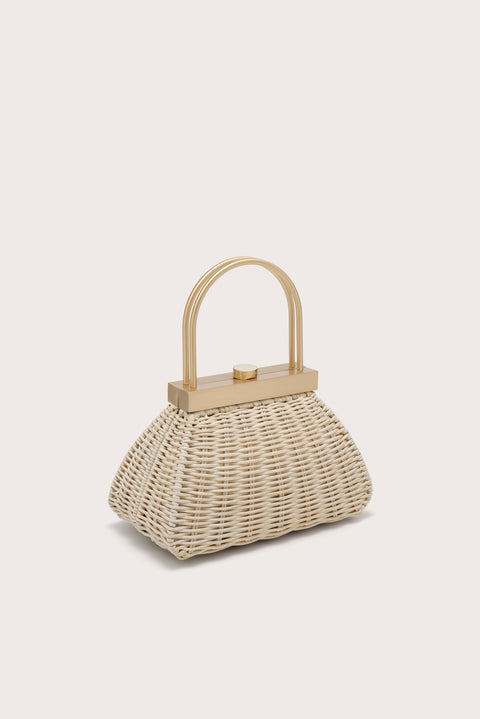 Woven handbag with wooden handle on a light beige background