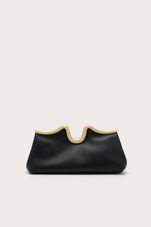 Black clutch bag with beige top edge on a light gray background