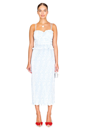 Model facing front in the brisha pleated cami dress in light blue pattern.