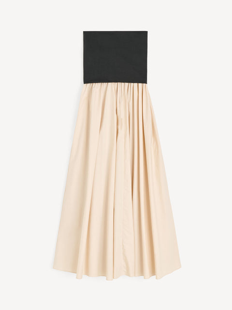 Flat lay of Woman black and beige dress on a white background.