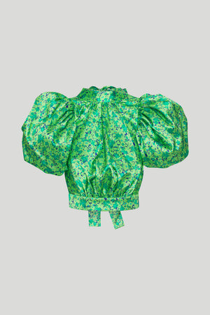 Ghost image of the dawn cropped puff sleeve top in green print.