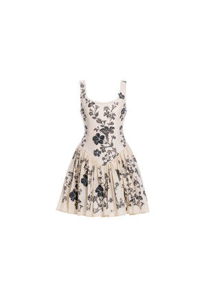 White linen mini dress with multicolored floral embroidery.