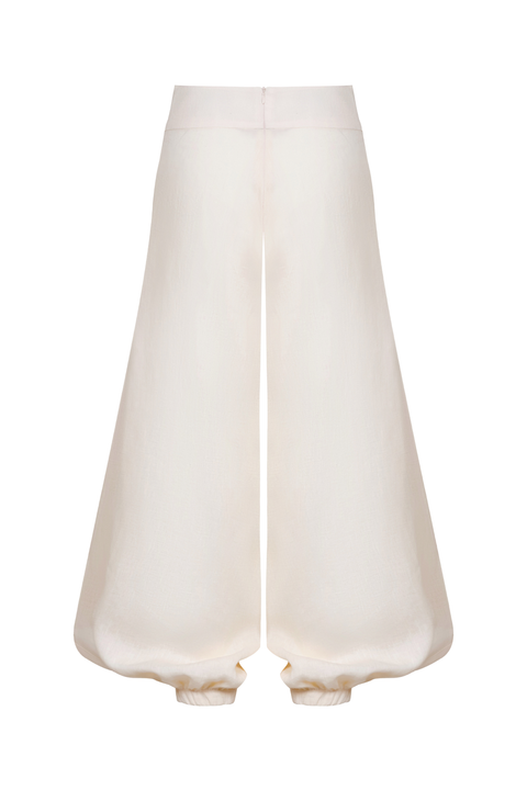 A pair of wide-leg trousers in a soft cream or off-white fabric, displayed against a solid white background.