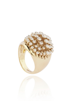 Gold ring with diamond cluster on a white background
