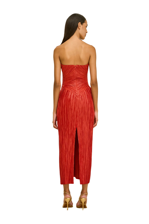 Woman wearing a red strapless dress with a slit back angle