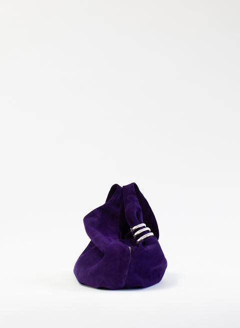 Another view of the purple suede bag with a white background