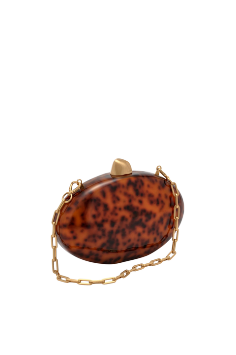 Oval tortoiseshell clutch bag with gold closure and gold strap chain