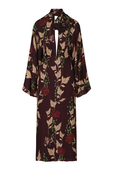 A long-sleeved midi dress with a dark brown base and a floral print featuring beige leaves, red flowers, and green stems, shown against a plain white background.