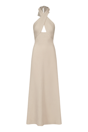 An ankle-length halter-neck dress in a light beige or cream color, featuring a crossover front neckline with a keyhole cutout