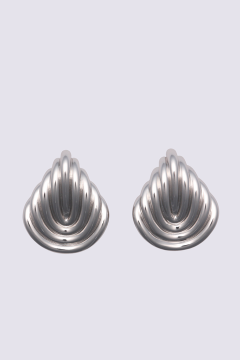 Pair of silver ribbed reverse teardrop earrings on a light gray background