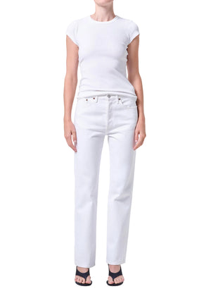 Person wearing a white t-shirt and white, mid-rise, straight-leg jeans on a white background facing forward