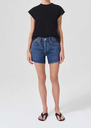 Model wearing the parker long short in dark wash enamour