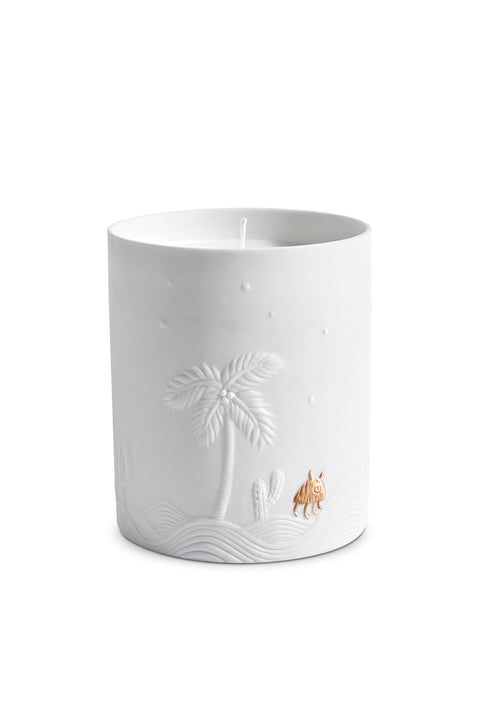 White ceramic candle with etched palm tree desert design.