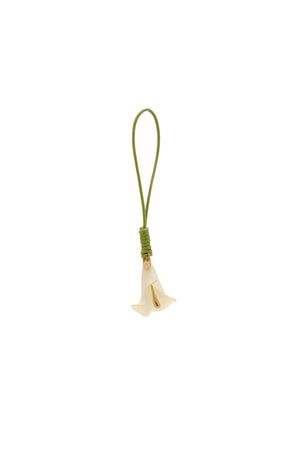 Small white calla lily bag charm on a green leather cord.