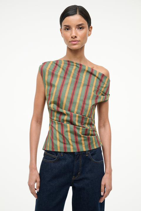 Woman wearing a striped top and jeans on a white background