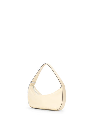 Side angle of a cream shoulder bag.