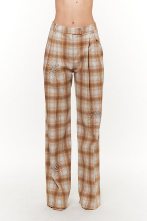 Plaid pants with embellishments on a white background