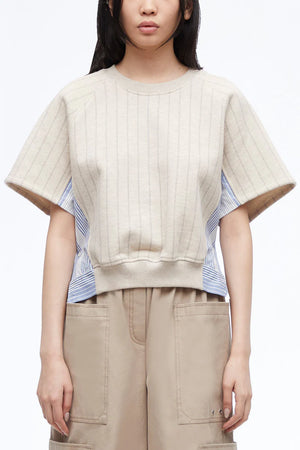 Up close of model wearing the striped short sleeve terry sweatshirt in cream.