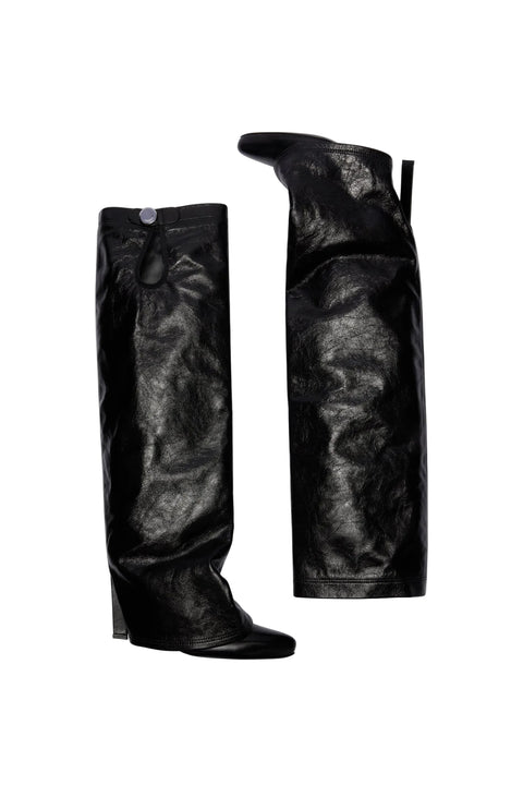 Pair of black leather knee high boots on a white background