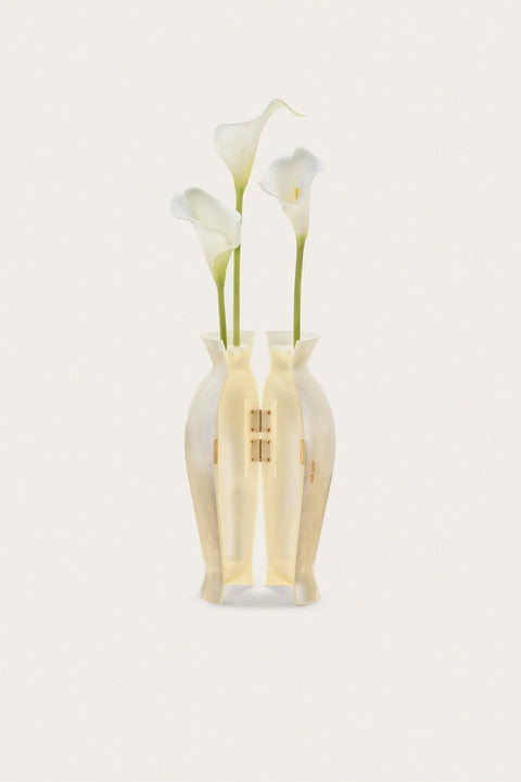 Opened pearlescent vase clutch with white flowers on a white background