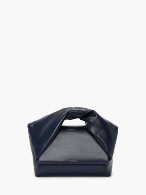 Ghost image of the navy leather twister handbag.