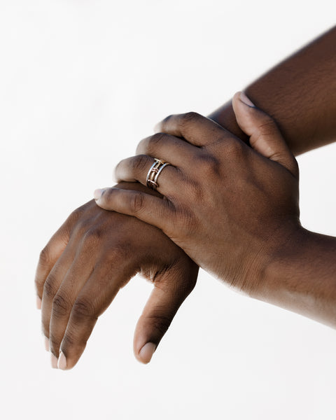 On model image of a Spinelli Kilcollin Acacia MX ring.