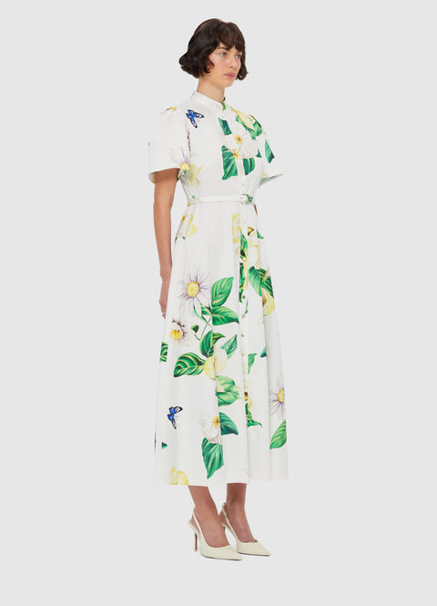 Woman facing at an angle in the short sleeve belted midi dress.