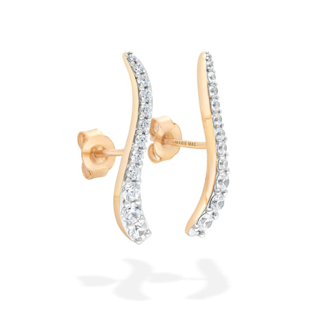 yellow gold earrings with diamonds showing backing of earring on a white background