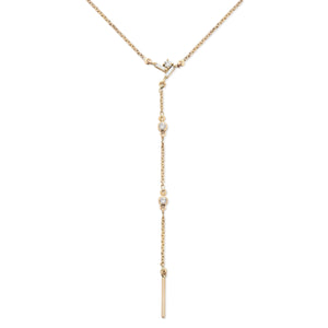 Yellow gold drop lariat necklace with diamonds.