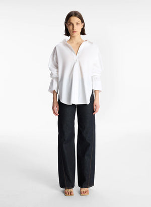 Forward facing model wearing the white monica button up top.