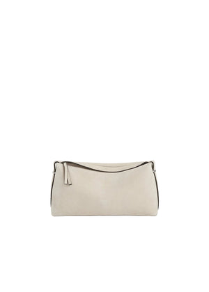 Beige suede handbag on a light beige background