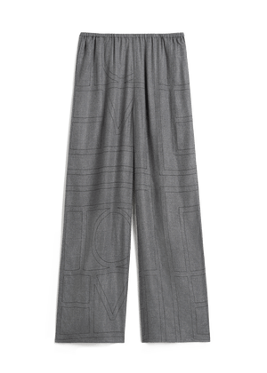 Gray wide leg flannel pants with monogram pattern in contrast stitching.