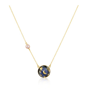 Necklace with a blue pendant and pink bead on a white background