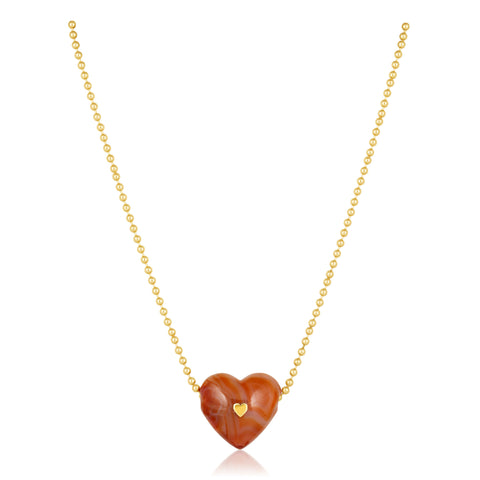 Necklace with a heart-shaped brown pendant and gold chain on a white background