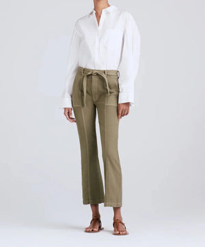 From the neck down shot of model wearing the dean utility flare pant in green khaki.