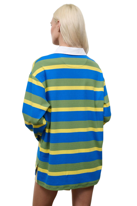 Woman wearing a blue, green, and yellow striped shirt with a white collar on a white background back angle