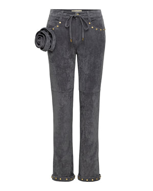 Dark gray pants with gold buttons and a rosette on a white background