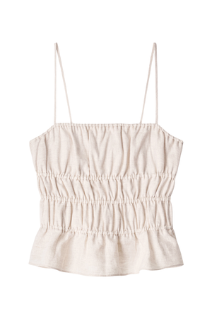 A light beige linen camisole top with thin spaghetti straps and a smocked bodice, shown flat on a white background.