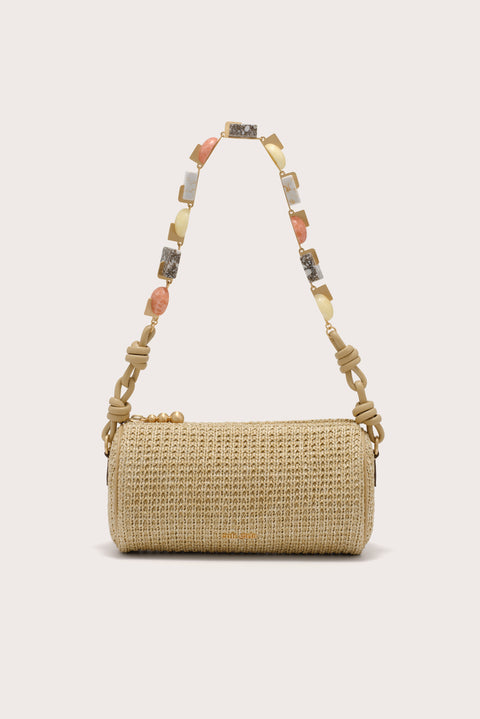 Woven handbag with a colorful beaded strap on a light background