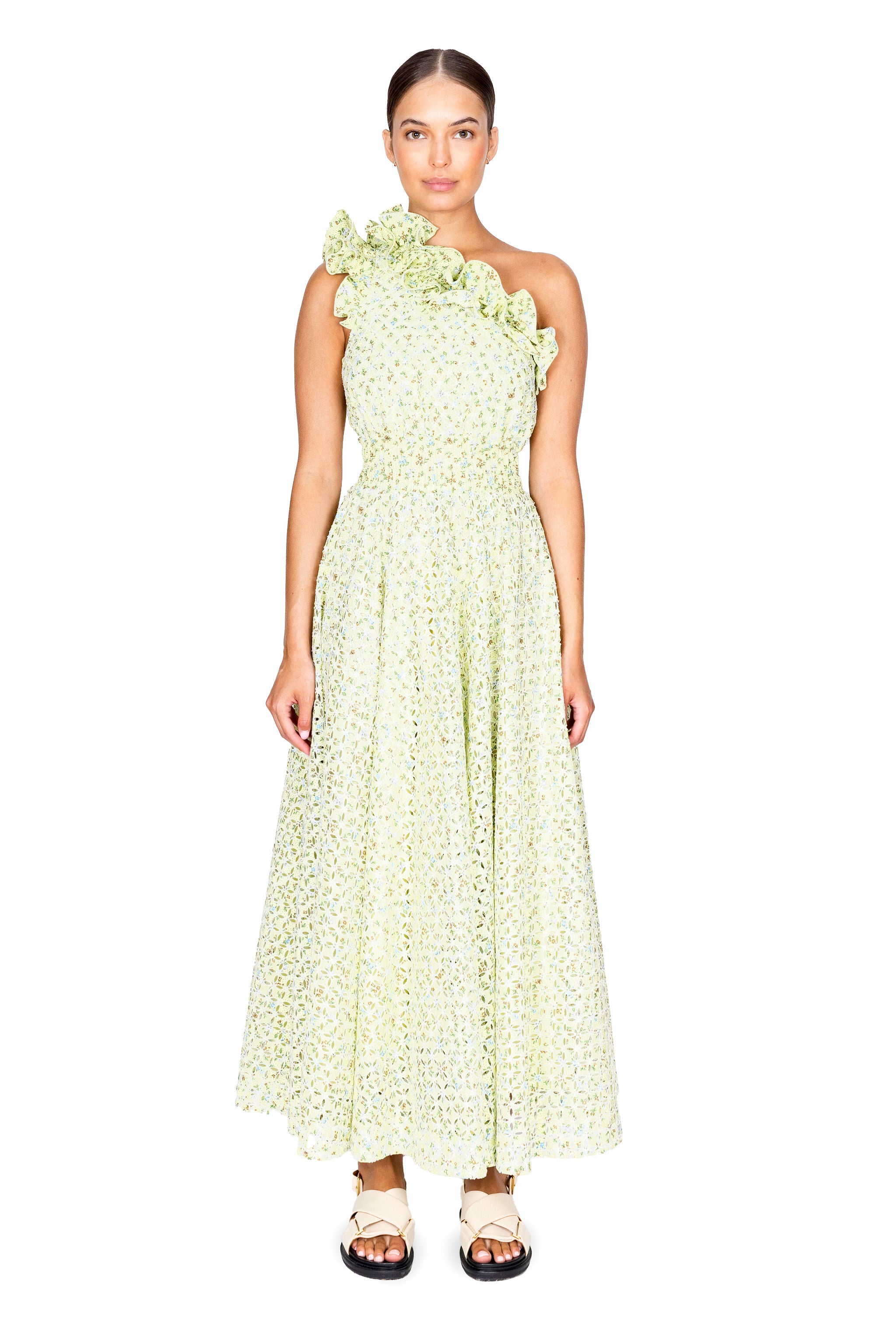Model facing camera wearing the maeve ruffle one shoulder midi dress in pale mint eyelet floral.