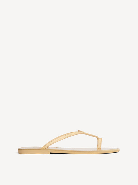 Side view of one leather flip flop.