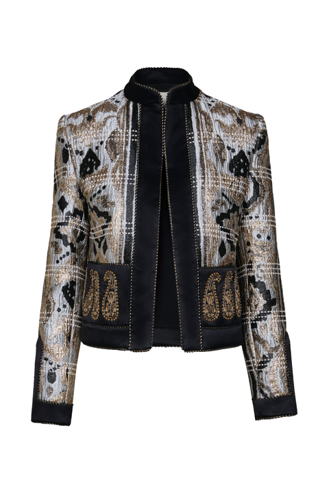 A cropped jacket featuring a shimmery medallion and paisley pattern in gold, blue, and black, with solid black velvet-like trim on the collar, front placket, cuffs, and hem