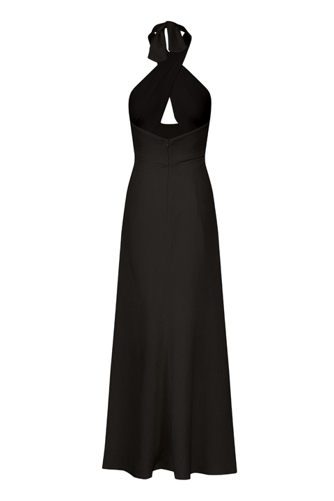 An ankle-length halter-neck black dress on a white background