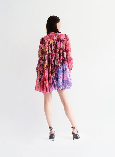 Model facing away showing the back of the vision smock mini dress.