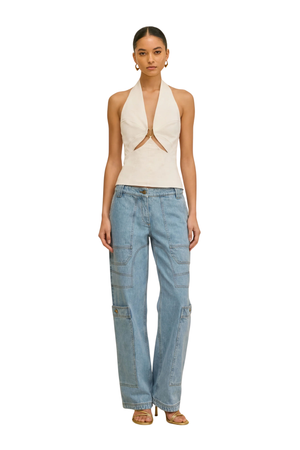 Woman wearing light blue low rise pocket jeans front angle