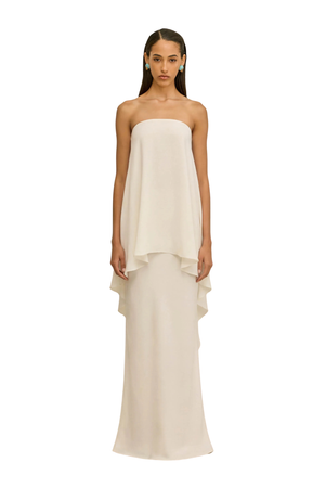 Woman wearing a beige long skirt set 