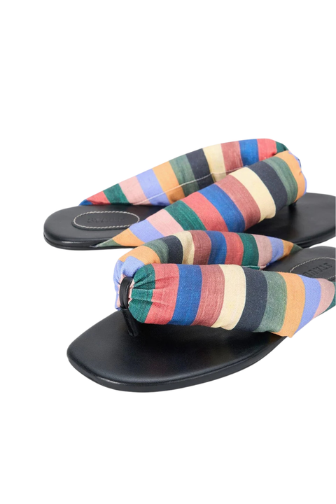 A puffy flip flop with a rainbow striped thong