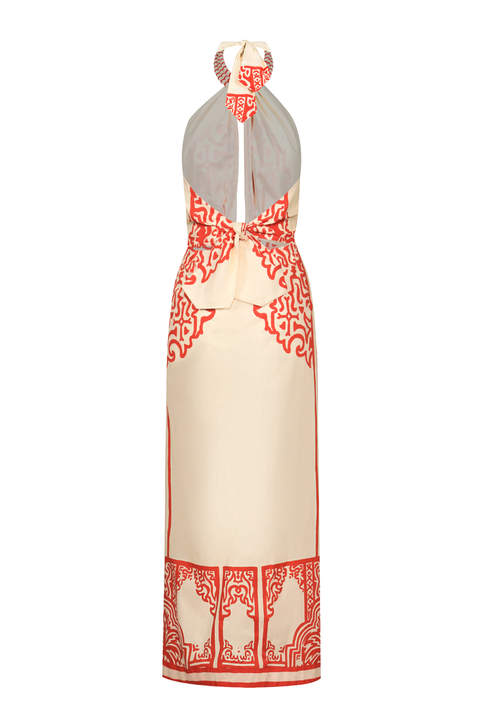 A cream halter-neck maxi dress with red ornamental border and pattern details, shown against a plain white background.
