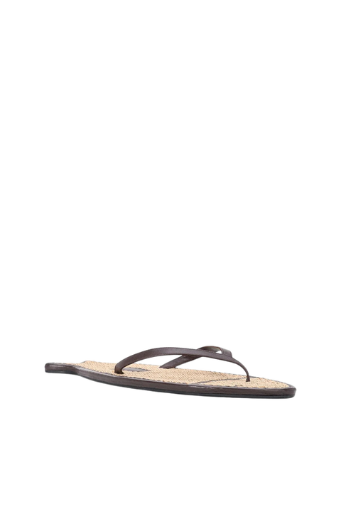A rattan and leather flip flop shaped like a fish